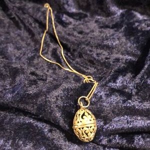 Vintage sterling silver egg shaped locket with scroll work